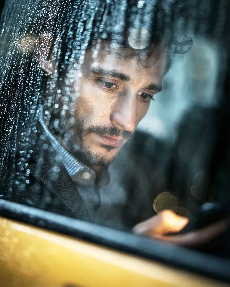 Man experiencing anxiety in a taxi