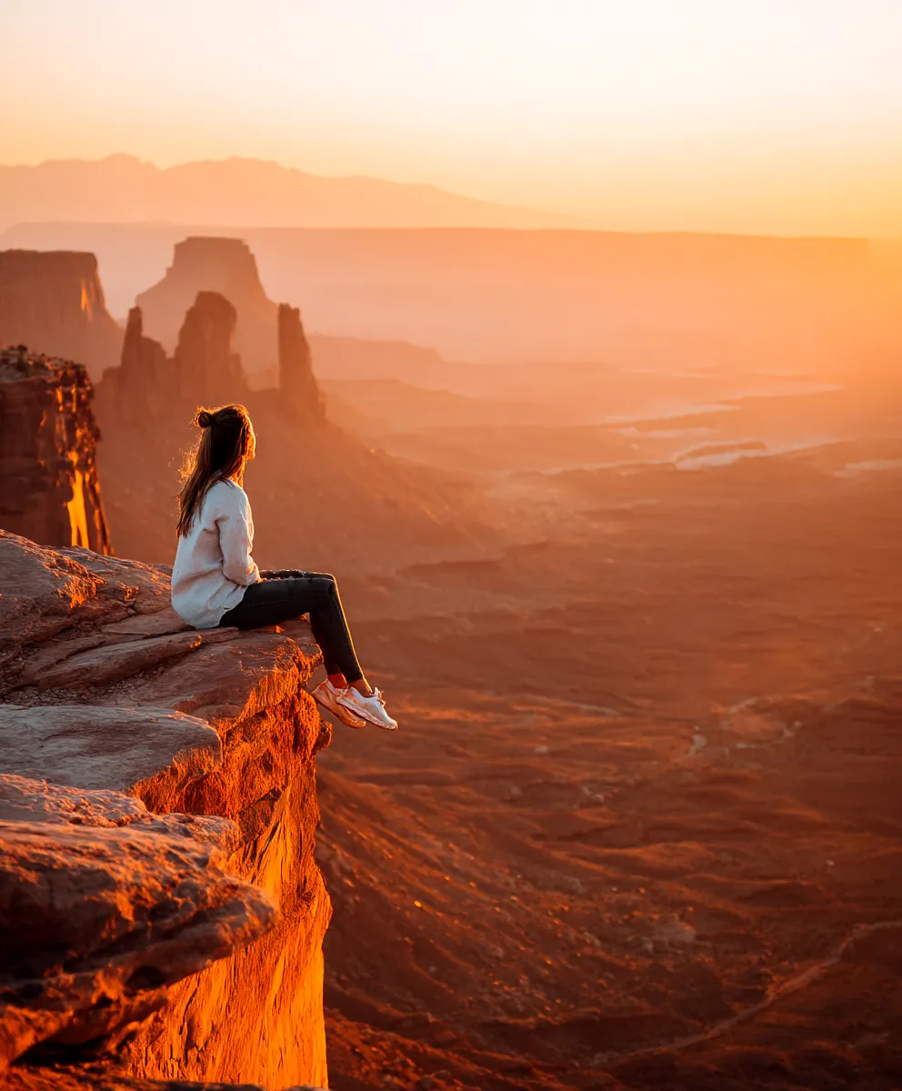 Woman overlooking a valley showing mental growth