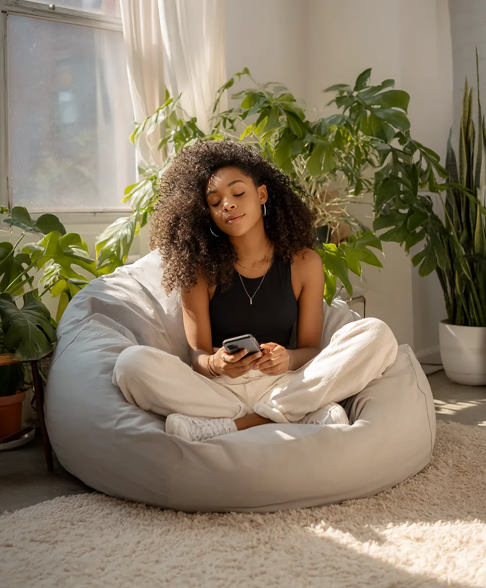 Woman relaxing while using Undelulu on her phone